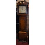 An early 19th century provincial oak and mahogany crossbanded longcase clock, having a painted