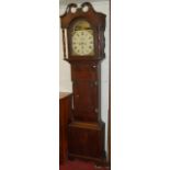 A circa 1800 North Country mahogany and ebony strung longcase clock, having a painted arched dial