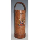 An early 20th century canvas and leather covered charge carrier, having a leather swing handle and
