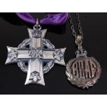 A WW II Canadian silver memorial cross, George VI, naming L.A.C. J. MOORE. R200738, together with