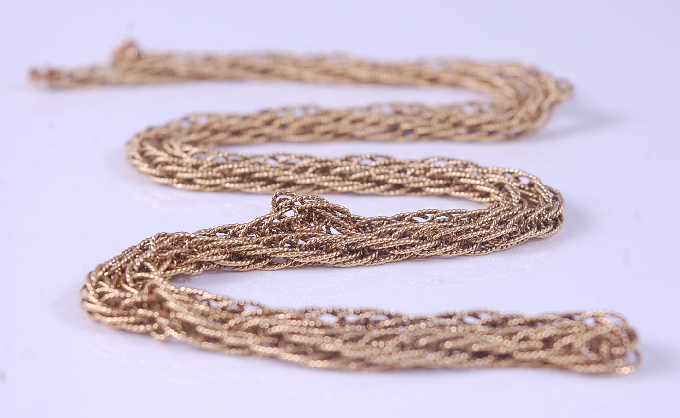 An 18ct yellow gold multi-strand necklet, with ropetwist chains and engraved cylindrical box clasp