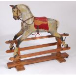 A good Victorian childs' dapple-grey rocking horse by Ayres of London, having horse hair mane and