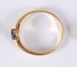 A yellow metal, sapphire and diamond dress ring, comprising an oval faceted sapphire in a four - Image 3 of 3