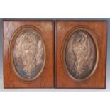 A pair of German third quarter 19th century electro-plated relief decorated panels, each depicting