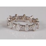 A continental 18ct white gold and diamond set eternity ring, arranged as alternating marquise and