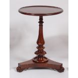 A 19th century and later adapted rosewood and mahogany circular pedestal lamp table, having a dished