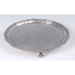 A modern silver salver, having a gadrooned piecrust rim, undecorated, 12.3oz, maker CJ Vander Ltd,