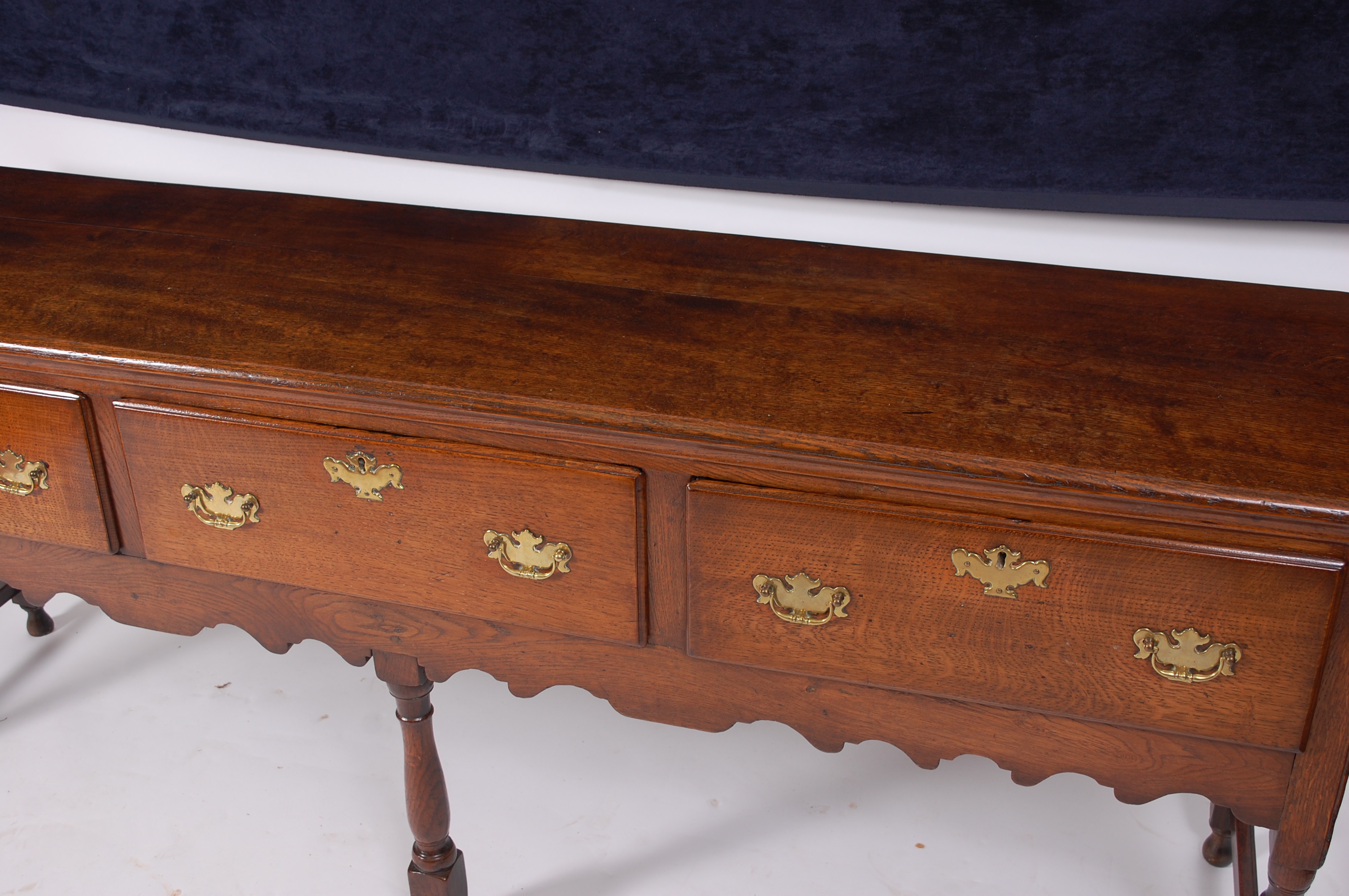 An oak dresser base in the Georgian style, having an arrangement of three frieze drawers with - Image 2 of 3