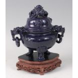 A Chinese carved blue glass censor and cover, having lion mask ends with ring handles, all raised on