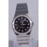 A lady's Omega steel Constellation wristwatch, having a signed black dial with diamond markers,