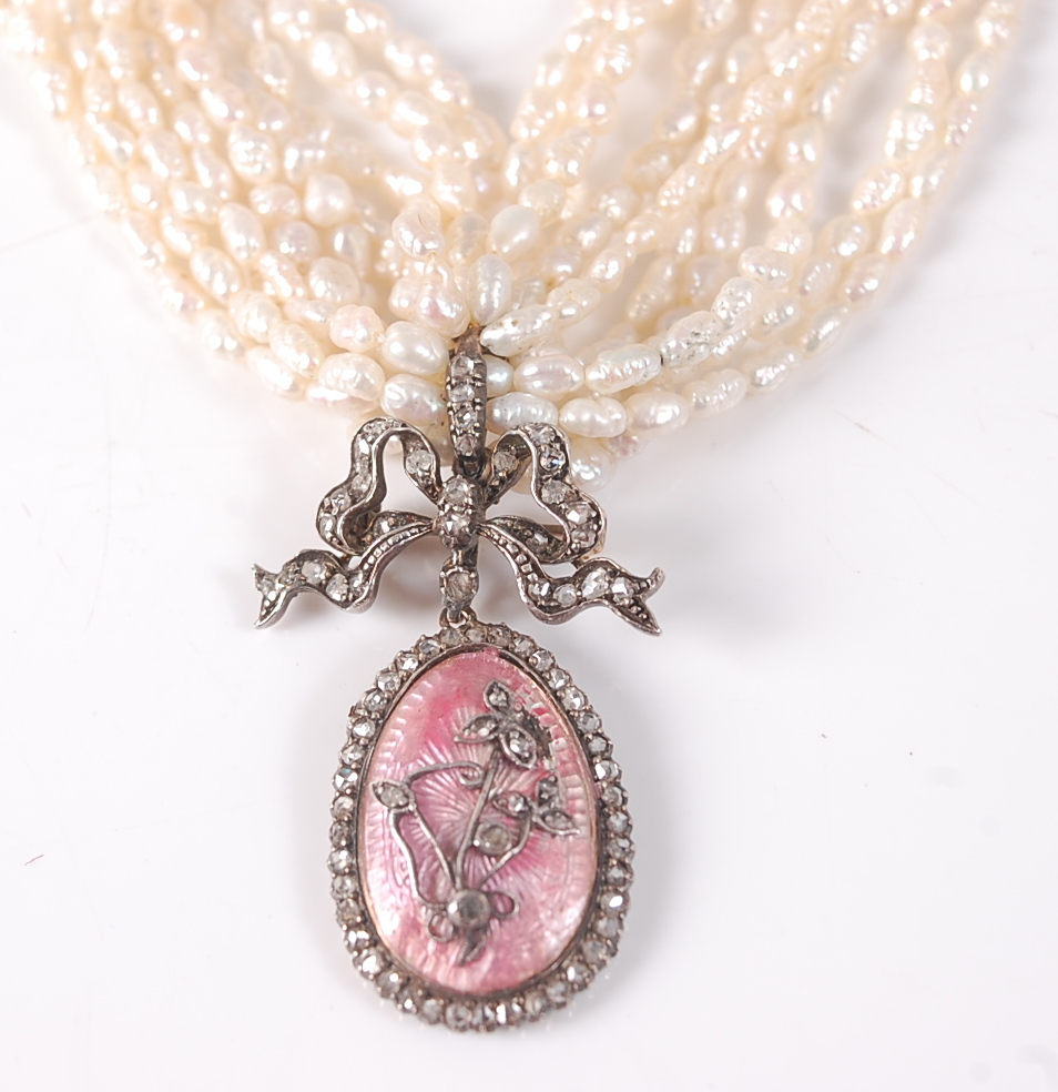 A ten row twisted baroque freshwater pearl necklet, with an oval pendant in pink guilloche with - Image 2 of 4