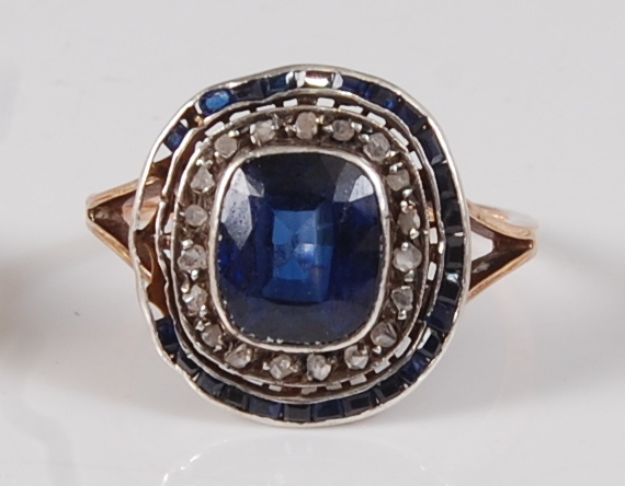 An early 19th century rose and white metal, sapphire and diamond oval cluster ring, featuring a