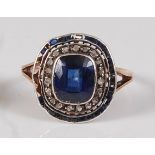 An early 19th century rose and white metal, sapphire and diamond oval cluster ring, featuring a
