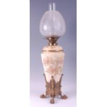 A circa 1900 Staffordshire soft paste porcelain and gilt brass mounted oil lamp, having an acid