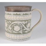 A Wedgwood green jasper ware tankard, having a silver rim hallmarked London 1903, the tankard