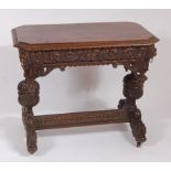 A late 19th century heavily carved oak single drawer hall table, having egg & dart moulded upper