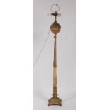 An early 20th century French gilt bronze and onyx standard lamp, with triple light fitting over