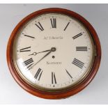 A Victorian mahogany circular dial wall clock, having a brass bezel, the convex white enamel dial