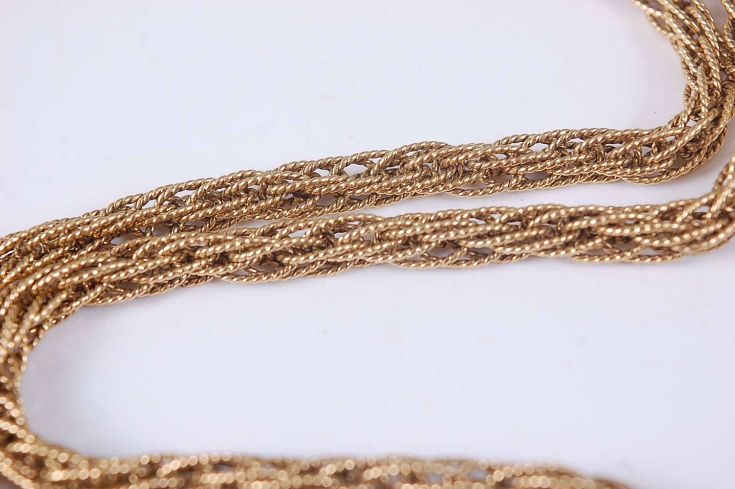 An 18ct yellow gold multi-strand necklet, with ropetwist chains and engraved cylindrical box clasp - Image 2 of 2