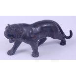 A Japanese Meiji Period (1868-1912) bronze Tiger, in standing roaring pose, with patinated stripes