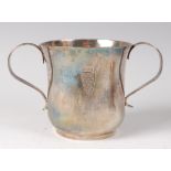 An early George III silver twin handled porringer, having engraved armorial, 2.9oz, maker I.M.,