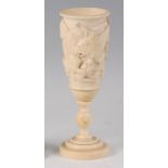 A circa 1900 continental carved ivory wine chalice, of circular tapering form, the body decorated