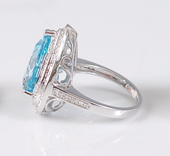 A white gold, blue topaz and diamond pear shaped cluster ring, comprising a centre pear cut blue - Image 2 of 2