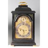 Daniel Vauguion of London - a mid-18th century ebonised bracket clock, the arched brass dial