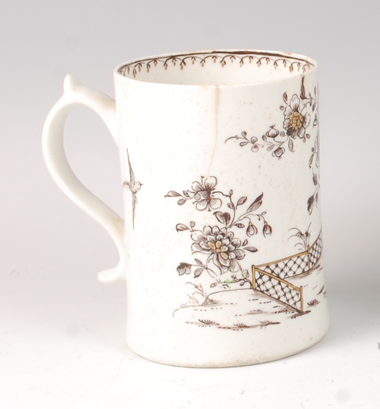 A Lowestoft porcelain tankard, circa 1770, with black pencil sepia and gilt highlighted decoration