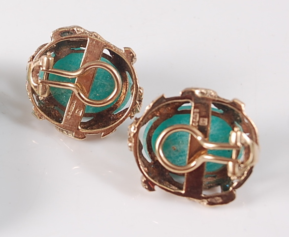 A pair of 9ct yellow gold abstract earrings, each featuring an oval dyed green cabochon stone within - Image 2 of 2
