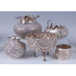 Assorted Indian silverwares, comprising a squat circular vase, all-over embossed with scroll flowers