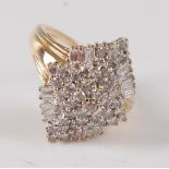 A 14ct yellow and white gold diamond marquise shaped cluster ring, comprising a centre panel of 41