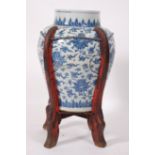 A large Chinese Ming Dynasty (1368-1644) blue and white stoneware floor vase, decorated with