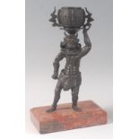 A Japanese late Edo period (1615-1868) bronze standing model of an Oni holding a twin decorated