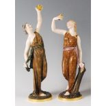 A pair of Royal Worcester porcelain figurines depicting Liberty and Captivity, each holding a