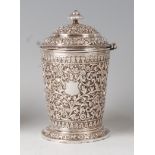 A late 19th century Indian silver jar and cover, having a finial topped hinged dome cover, the jar