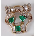 A yellow and white metal, emerald and diamond cat's head brooch, comprising two pear and one