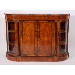 A Victorian figured walnut and marquetry inlaid breakfront credenza, having bowed glazed ends