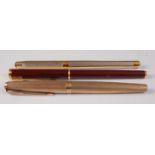 A Parker 61 9ct engine turned gold fountain pen, the case with vacant cartouche, gross weight 26.6g,