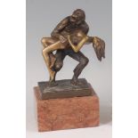 After Bruno Zach - a bronze figural group of a standing chimpanzee holding a nude woman , raised