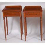 A pair of rosewood, walnut and satinwood inlaid ledgeback single drawer lamp tables, each raised