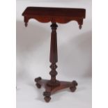 A William IV rosewood round cornered fixed top pedestal occasional table, having acorn turned