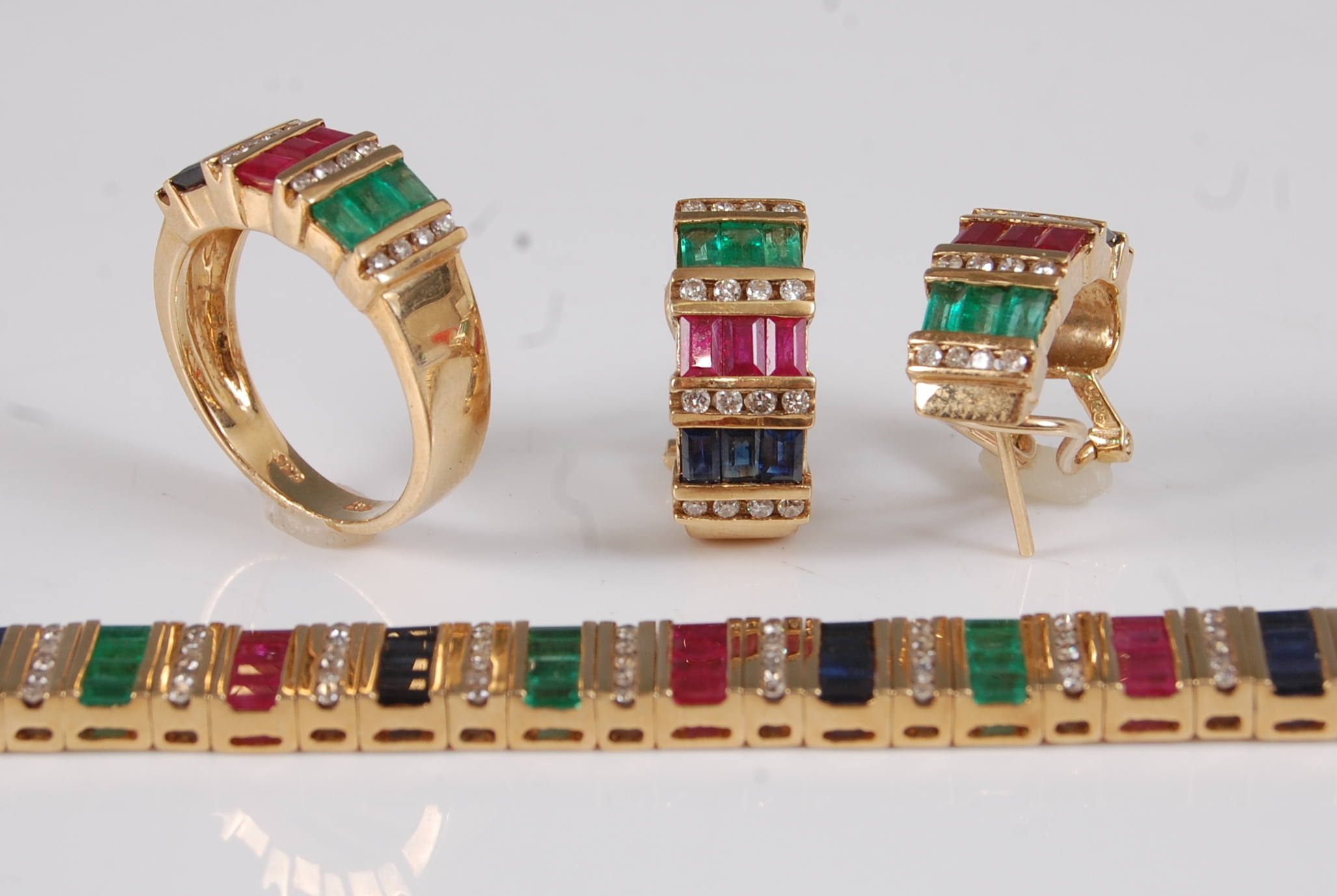 An 18ct gold multi-stone suite of jewellery, comprising bracelet, pair of earrings, and a ring, each - Image 2 of 2