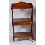 A Regency rosewood three tier whatnot, the top having a three quarter gallery, the centre section