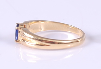 A yellow metal, sapphire and diamond dress ring, comprising an oval faceted sapphire in a four - Image 2 of 3