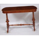 A mid-Victorian figured walnut hall table, having curved ends, the top with moulded edge over twin