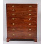 A large mahogany squarefront chest, of seven long graduated drawers, each with pressed brass oval