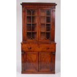 A William IV mahogany secretaire bookcase, the glazed upper section with square cut pilasters, above