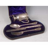 A Victorian silver four-piece christening set, comprising christening mug, dessert knife, fork and