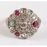 An 18ct and platinum diamond, ruby and emerald circular cluster ring, the nineteen old European